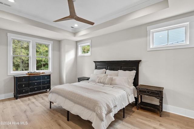 bedroom with baseboards, visible vents, wood finished floors, and recessed lighting