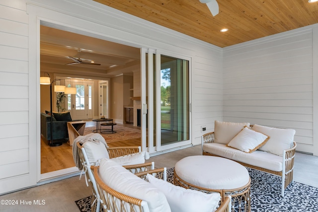 interior space featuring ceiling fan and wood ceiling