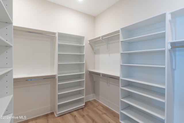 spacious closet with light wood-style floors