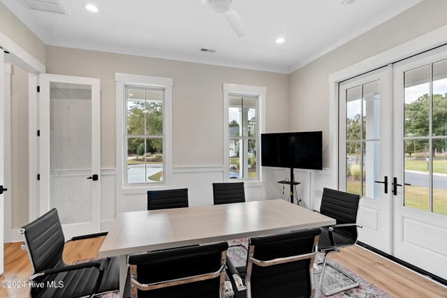 office area with a healthy amount of sunlight, visible vents, and light wood-style flooring