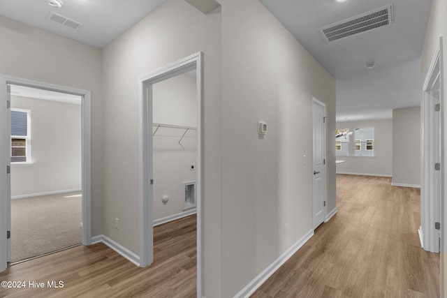 corridor featuring light hardwood / wood-style flooring