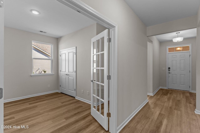 entrance foyer featuring light hardwood / wood-style floors