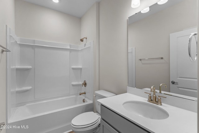 full bathroom featuring vanity, toilet, and shower / bathtub combination