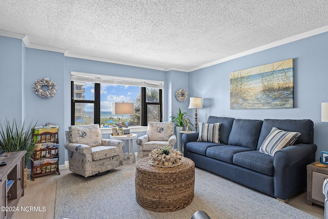 living room with a textured ceiling, crown molding, and light wood-type flooring