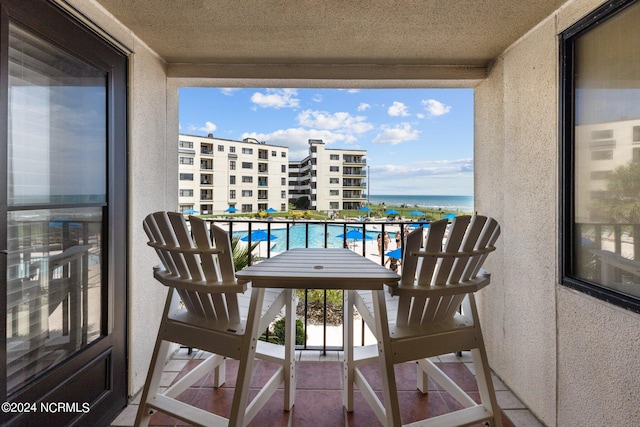 balcony featuring a water view