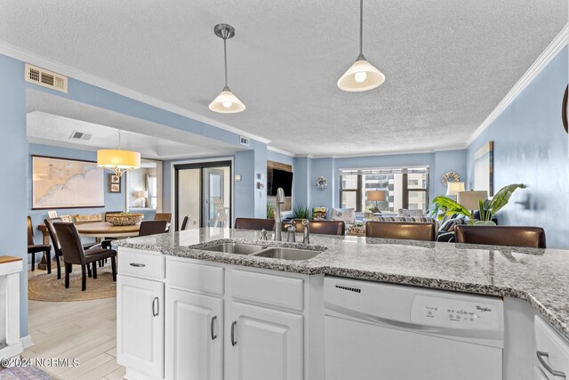 kitchen with white cabinets, white dishwasher, sink, light wood-type flooring, and ornamental molding