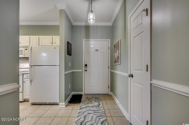 interior space with crown molding, hanging light fixtures, white appliances, and light tile patterned floors