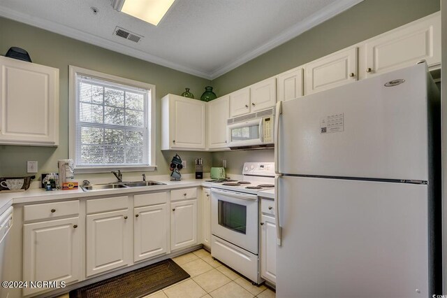 kitchen featuring light tile patterned flooring, white cabinetry, crown molding, white appliances, and sink