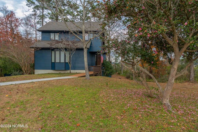 rear view of house with a lawn