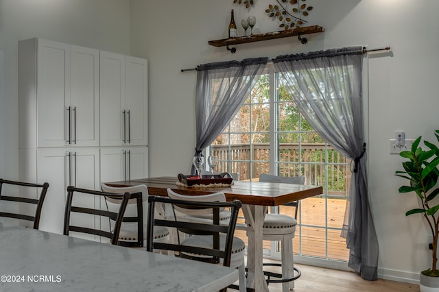 dining space featuring light hardwood / wood-style flooring