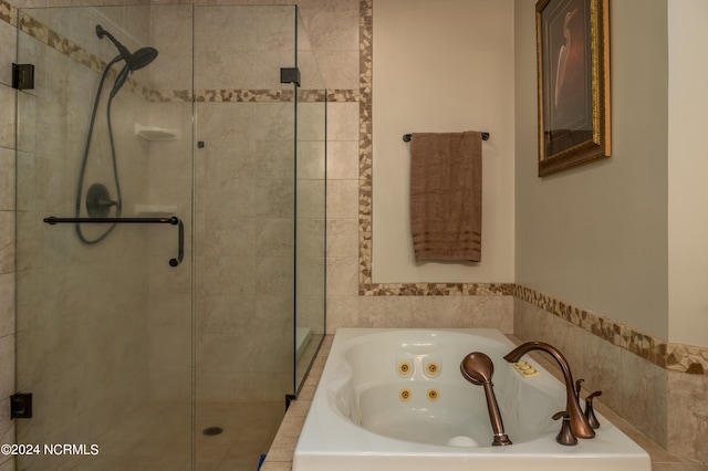 bathroom with shower with separate bathtub