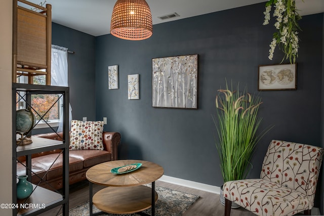 sitting room with hardwood / wood-style floors