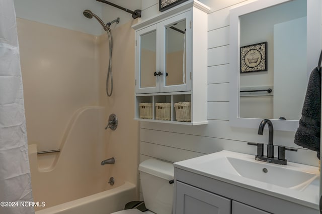 full bathroom featuring shower / bath combination with curtain, toilet, and vanity