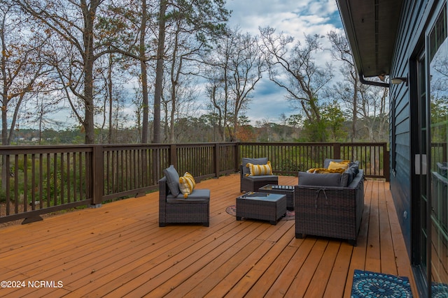 wooden deck with an outdoor living space