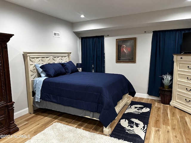 bedroom featuring hardwood / wood-style flooring