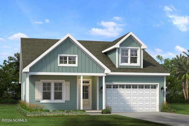 view of front of house with a front lawn and a garage