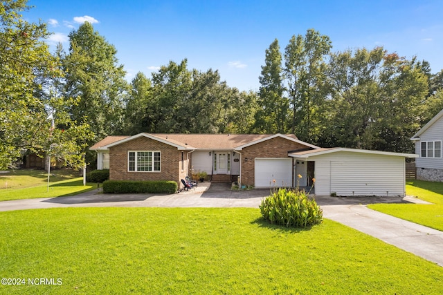 single story home featuring a front lawn, concrete driveway, and brick siding