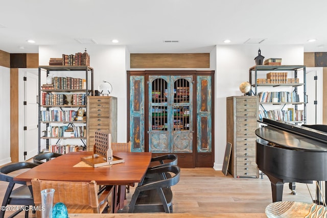 dining area with light hardwood / wood-style floors