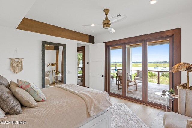 bedroom featuring access to exterior, ceiling fan, and light hardwood / wood-style floors