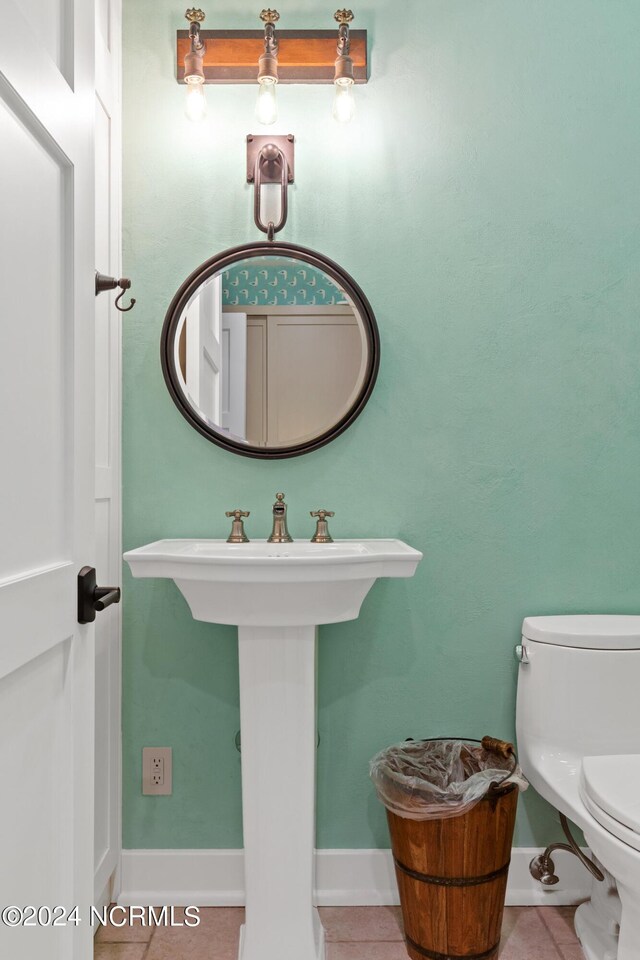 bathroom featuring toilet and tile patterned floors