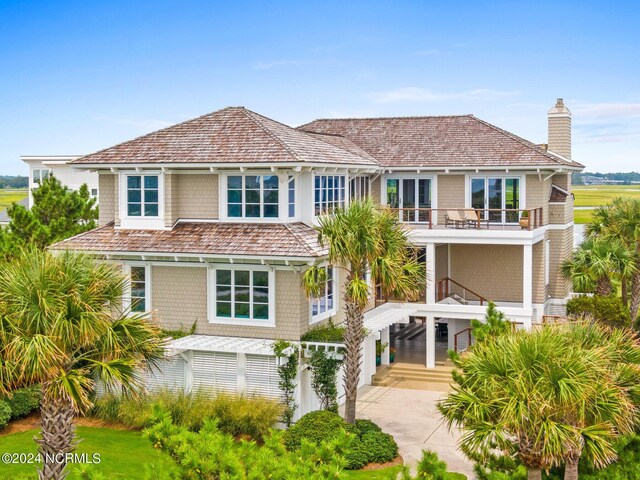 view of front of home with a balcony