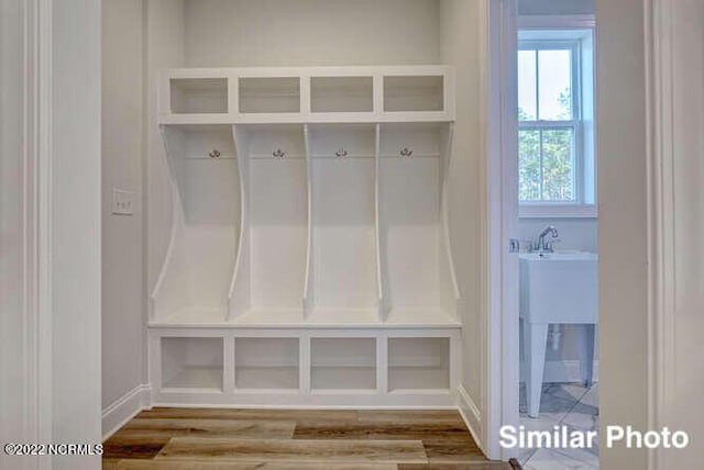 mudroom with wood finished floors