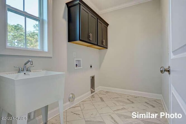 washroom featuring baseboards, washer hookup, cabinet space, and hookup for an electric dryer