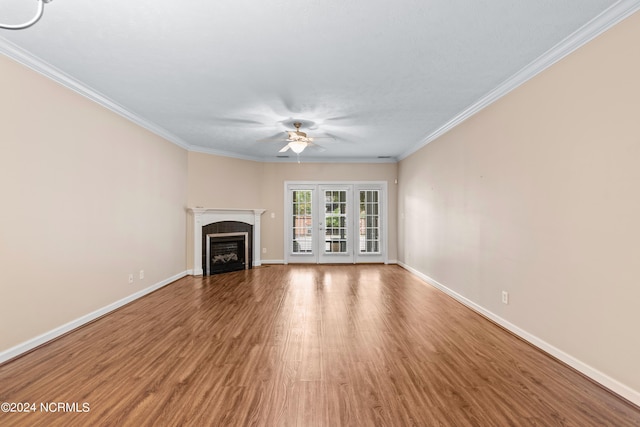 unfurnished living room featuring ceiling fan, hardwood / wood-style floors, and crown molding