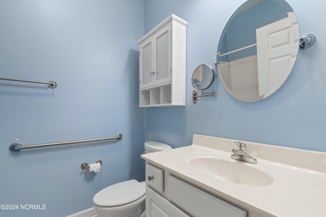 bathroom with toilet and vanity