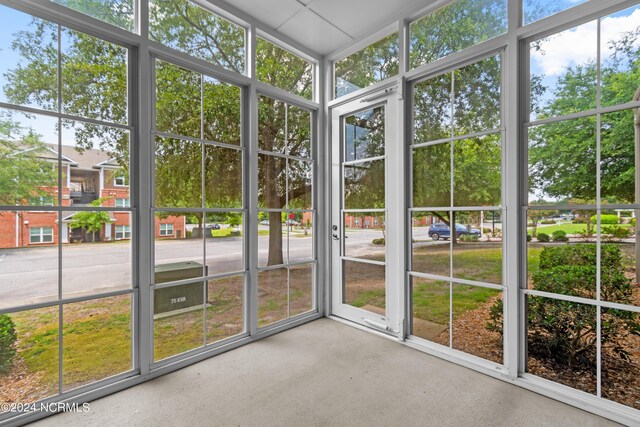 unfurnished sunroom featuring plenty of natural light