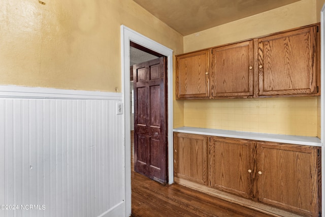 kitchen with dark wood-type flooring