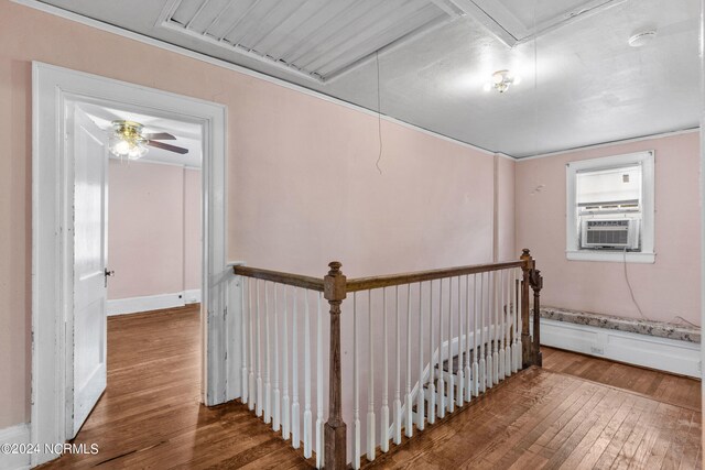 hallway with hardwood / wood-style flooring and cooling unit