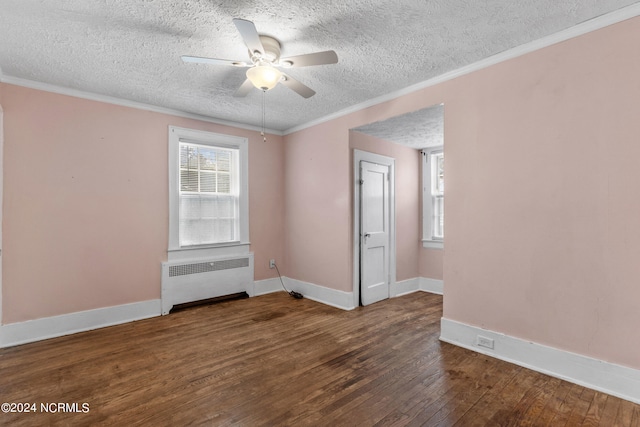 unfurnished room featuring a textured ceiling, dark hardwood / wood-style floors, radiator heating unit, ceiling fan, and ornamental molding