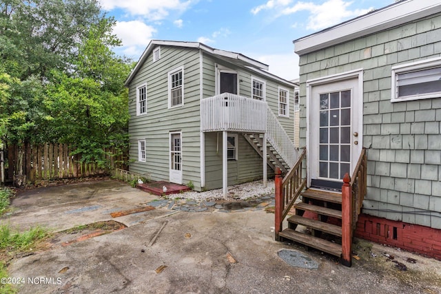 back of property with a patio