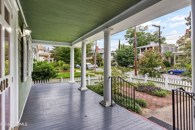 wooden terrace featuring covered porch