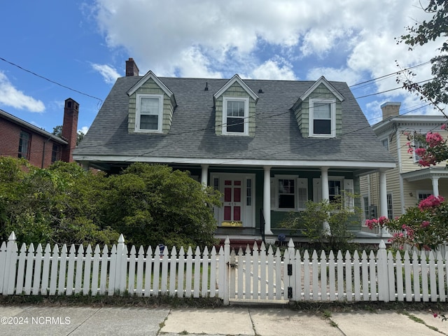 cape cod-style house with a porch