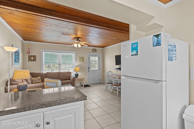 kitchen featuring wood ceiling, white cabinetry, white refrigerator, ornamental molding, and light tile patterned flooring