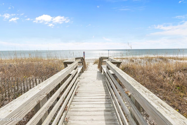 view of property's community featuring a view of the beach and a water view