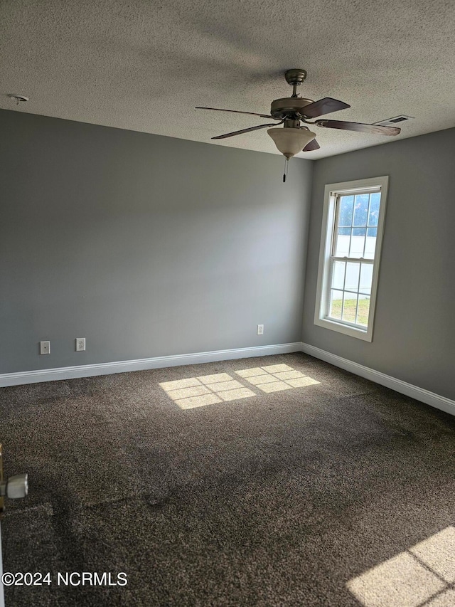 unfurnished room with carpet, a textured ceiling, and ceiling fan