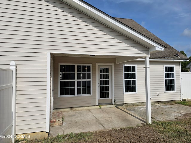 back of house with a patio