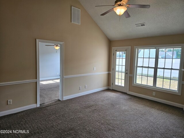 carpeted spare room with a textured ceiling, ceiling fan, and high vaulted ceiling