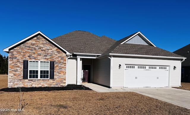 view of front of home featuring a garage and a front lawn