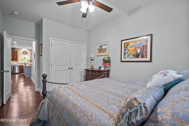 bedroom with ceiling fan, a closet, and dark wood-type flooring