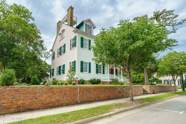 view of home's exterior with a chimney