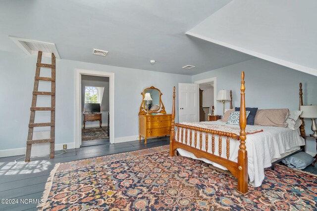 bedroom with hardwood / wood-style flooring