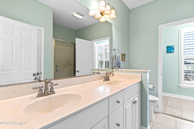 bathroom featuring an enclosed shower, tile patterned flooring, plenty of natural light, and toilet