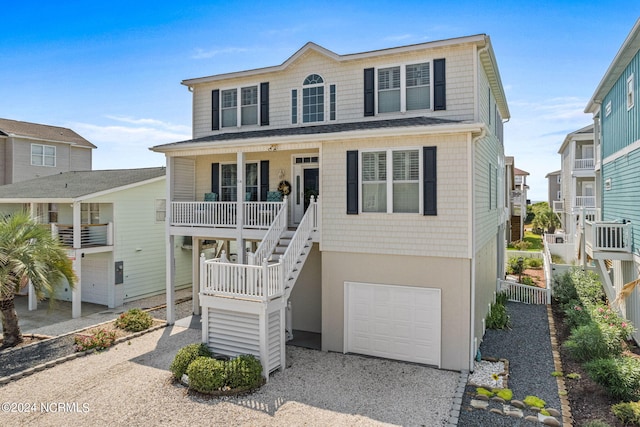 view of front of house with a garage and covered porch