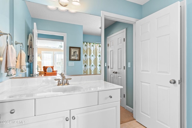 bathroom featuring tile patterned floors and vanity