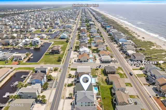 aerial view featuring a water view and a view of the beach