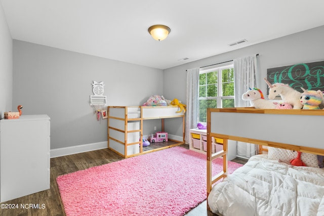 bedroom featuring dark wood-type flooring